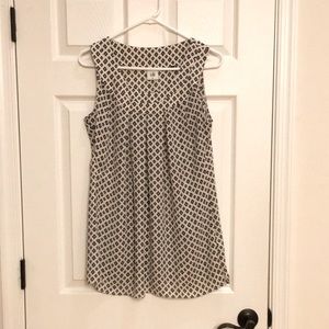 Cabi sleeveless top. White with black blue and pink accents. Size Med.